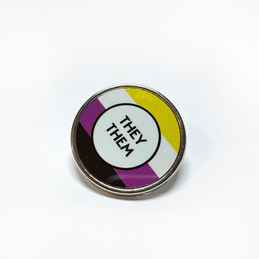 Non binary flag badge which reads they them